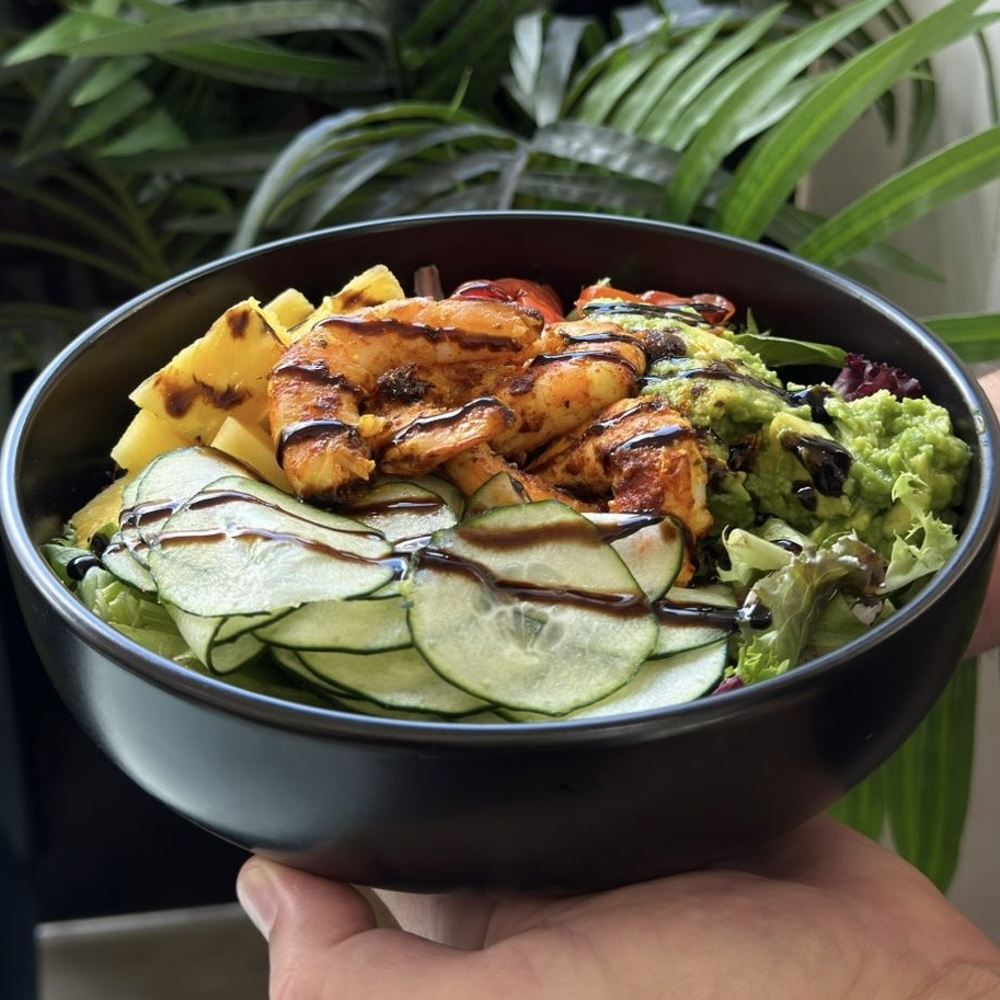 Salad, pineapple, shrimp, cucumber, guacamole, balsamic cream